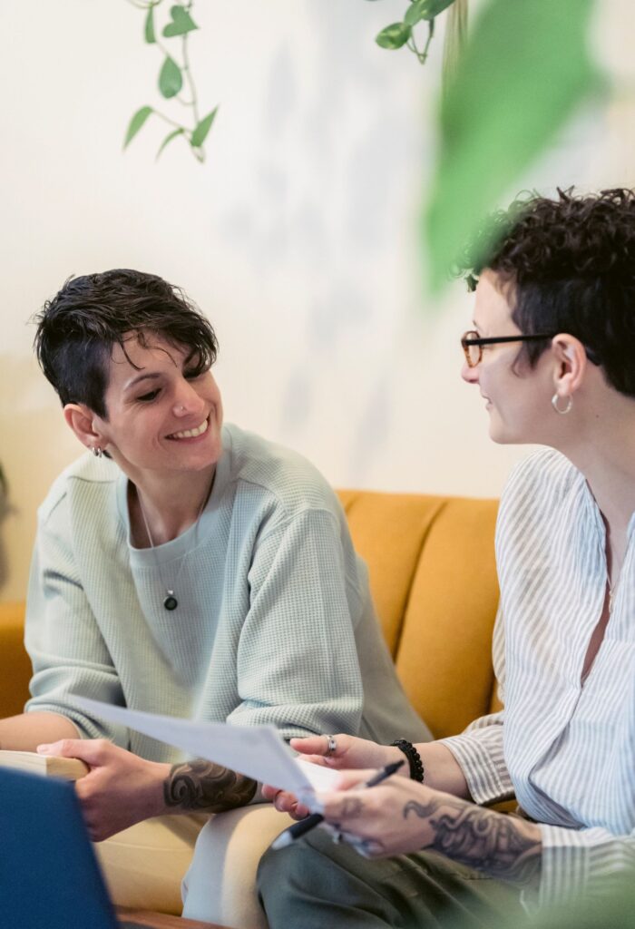 Women sitting on couch talking